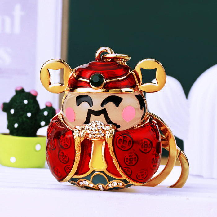 Jeweled Wealth Deity Keychain with Red Enamel and Gold Tone Trim