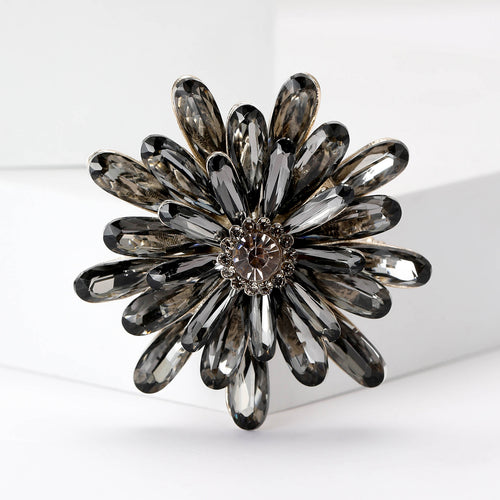 Grey smoky crystal flower brooch close-up