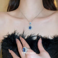Silver Blue Oval Halo Necklace Earrings And Ring Set view 3