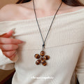 Black Flower Oval Cabochon Pendant Cord Necklace Silver Frame view 4