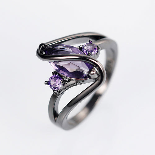 Purple marquise ring angled view on white background