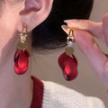 Red Curved Petal Drop Earrings With Crystal Accents view 1
