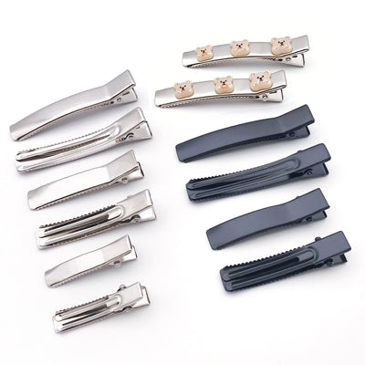 Metallic assorted shape charms arranged on a light background