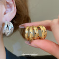 Gold Tone Triple Hoop Earrings With Black Dot Details view 2