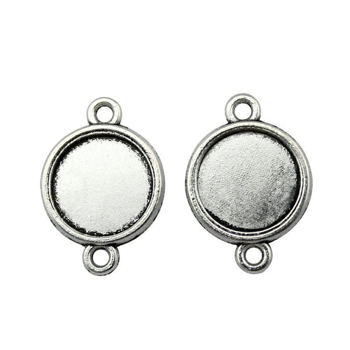 Double Loop Round Cabochon Connectors in Four Options held in hand for scale