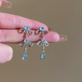 Silver Bow and Blue Crystal Drop Earrings for Everyday Styling view 2