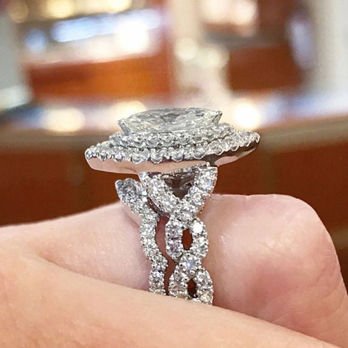 Silver marquise halo ring side profile showing paved infinity shank