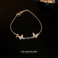 Gold Tone Butterfly Bracelet With Clear Crystal And White Shell Like Wings view 3