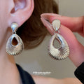Ridged Open Teardrop Clip On Earrings in Silver with Polished Details view 4