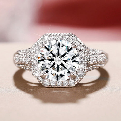 Side view of silver tone round center ring