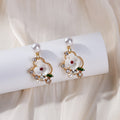 White Flower Pearl Look Green Leaf Gold Stud Earrings view 2