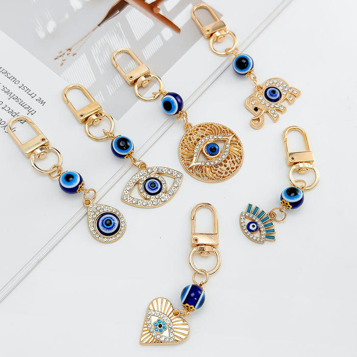 Gold-Tone Evil Eye Bead Keychain With Rhinestone Charm Pendant