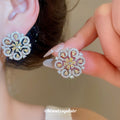 Swirl Flower Stud Earrings in Gold and Silver Tones view 4