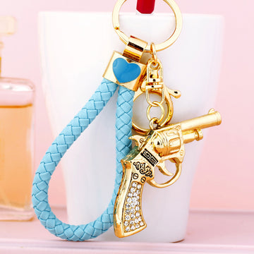 Jeweled Revolver Keychains with Red Yellow and Blue Braided Loop Options