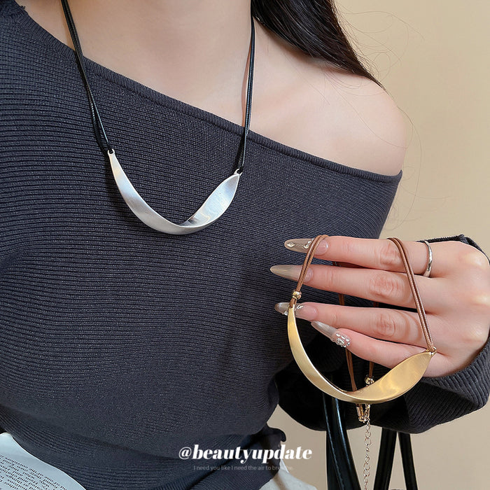 Curved Metal Bib Cord Necklace with Distinctive Textured Details