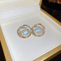 Round Opalescent Crystal Stud Earrings With Polished Metal Tone Details view 6