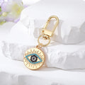 Gold and Silver Tone Crystal Round Evil Eye Clip Keychains in Six Designs view 3