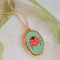 Apple Slice And Ladybug Pendant Necklaces In Gold Tone Metal view 4