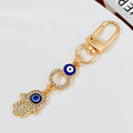 Gold-Tone Rhinestone Hamsa Hand Keychain With Evil Eye Charm view 6