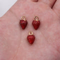 Textured Red Strawberry Charm with Green Enamel Leaf and Gold Tone Loop view 1