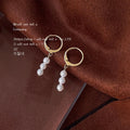Gold Tone Huggie Hoop Earrings With Triple White Pearl Drop view 2