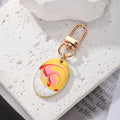 Gold Tone Oval Marbled Swirl Enamel Clip Keychains in Six Colors view 4