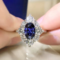 Deep Blue Oval Floral Cluster Statement Ring In Silver Tone view 1