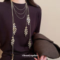 Silver Tone Layered Leaf Tassel Necklace With Decorative Metal Details view 1