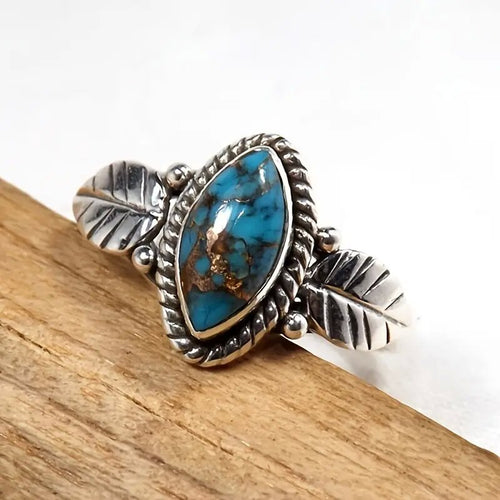 Second product view showing antiqued silver-tone turquoise-like marquise leaf ring