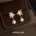 Gold Tone Clear Stone Open Star And White Pearl Drop Stud Earrings view 1