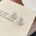 Silver Tone Bow and White Pearl Look Small Stud Earrings view 3