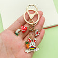 Easter Bunny Charm Keychains Featuring Pink Blossom Across 19 Pictured Variations view 1