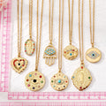 Gold Tone Colorful Crystal Evil Eye Hamsa and Mary Pendant Necklaces view 5