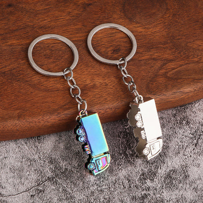 Iridescent and silver-tone truck keychains displayed side by side