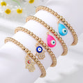 Gold Tone Beaded Teardrop Evil Eye and Hamsa Charm Bracelets view 2