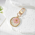 Irregular Gold Frame Dried Flower Resin Keychains Three Styles view 2