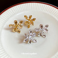 Sculpted Metal Flower Stud Earrings in Gold and Silver view 4