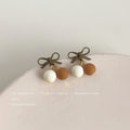 Olive Bow Stud Cream and Brown Ball Cherry Drop Earrings view 4