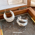 Layered Silver Tone Hoop Earrings with Black Dot Details view 4