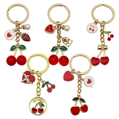 Overview showing the available color and design variations of the red cherry strawberry heart metal keychain