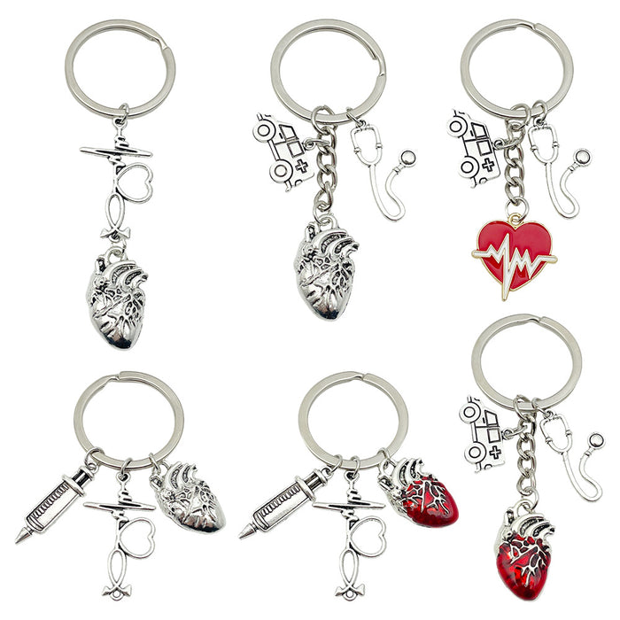 Six Silver Tone Medical Tool and Heart Keychains with Metal Hardware