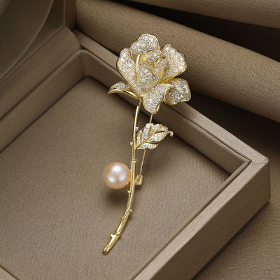 Gold-tone rhinestone rose stem brooch with peach pearl in box