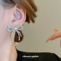 Silver Tone Crystal Bow Stud Earrings With Chain Tassels view 3