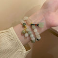 Four Mixed Beaded Bracelet Designs With Butterfly Fruit And Pod Charms view 1
