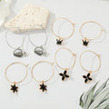 Gold Tone Black Enamel Symbol and Wine Bottle Hoop Drop Earrings view 1