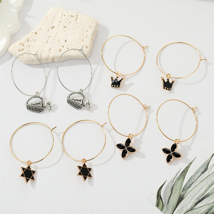 Gold Tone Black Enamel Symbol and Wine Bottle Hoop Drop Earrings