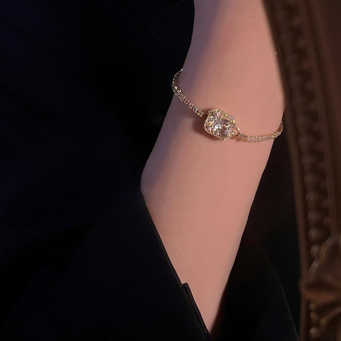 Gold Tone Tennis Bracelet With Square Clear Crystal Halo Center