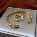 Four Gold Tone Bangle Styles With Shell Inlay And Crystal Details view 9