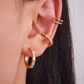 Crystal Crossed and Baguette Hoop Earrings in Gold and Silver Tone view 2