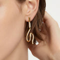 Long Crystal Wave Drop Earrings in Polished Gold Tone view 2